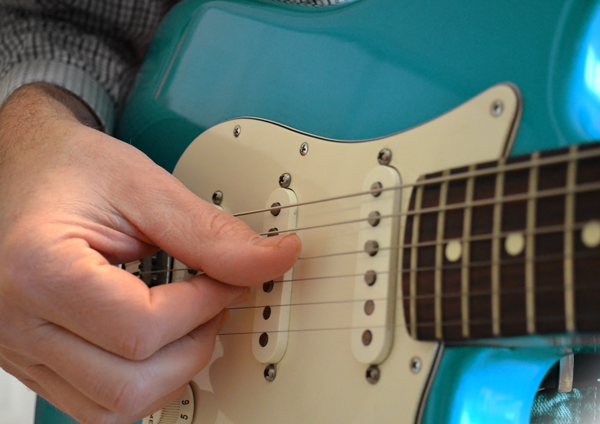 The passive magnetic pickups on a typical electric guitar produce a weak signal that is not compatible with the line-level input of a mixing console. 